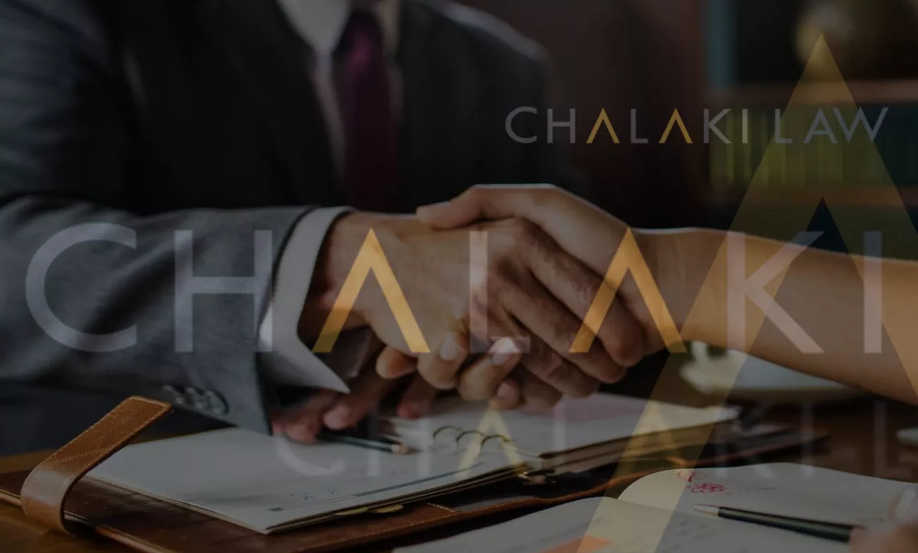 Chalaki shaking hands with a client